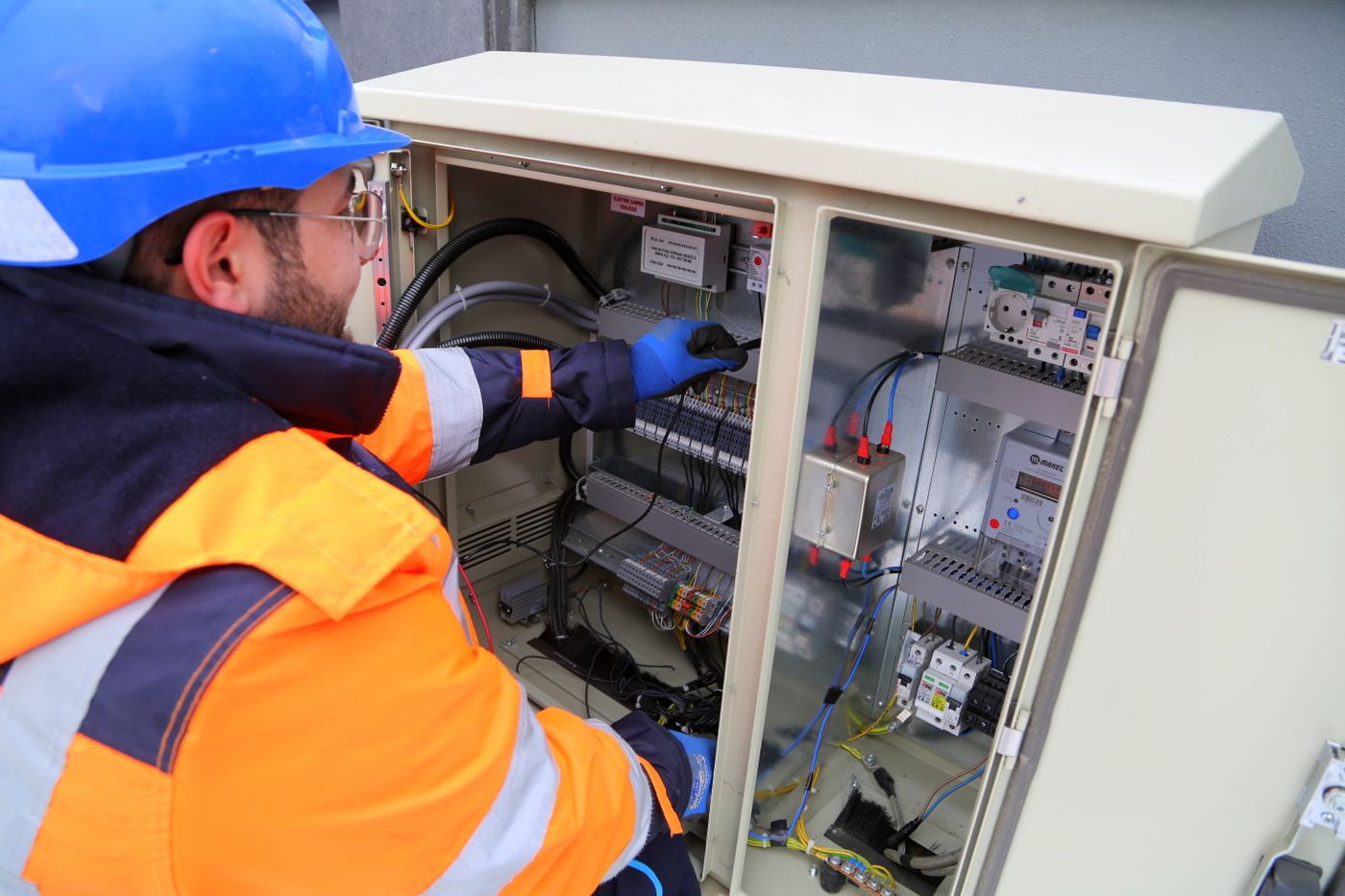 Electrician working on a commercial distribution board