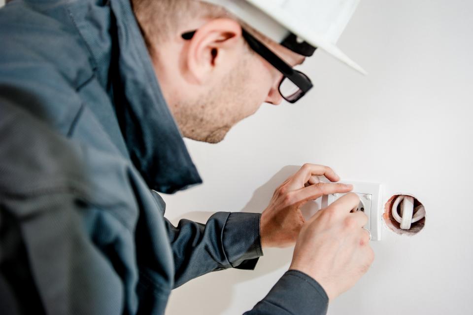 Experienced electrician at work